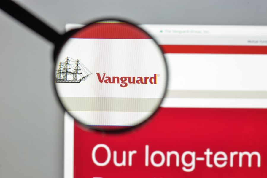 A magnifiying glass highlights the Vanguard website